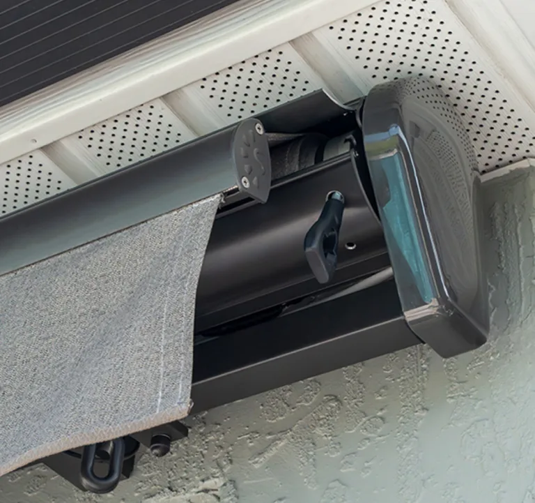 Sealed cassette housing protecting SunPro awning fabric arms and roller
